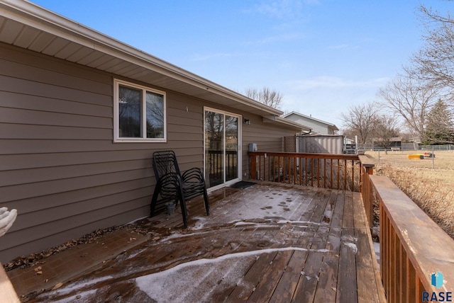 wooden terrace featuring fence