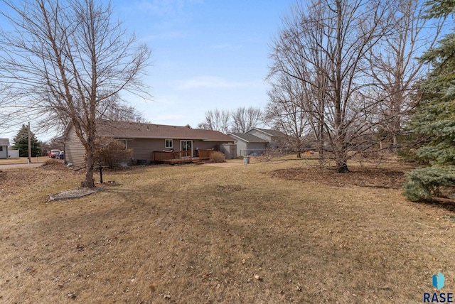 view of yard with a wooden deck