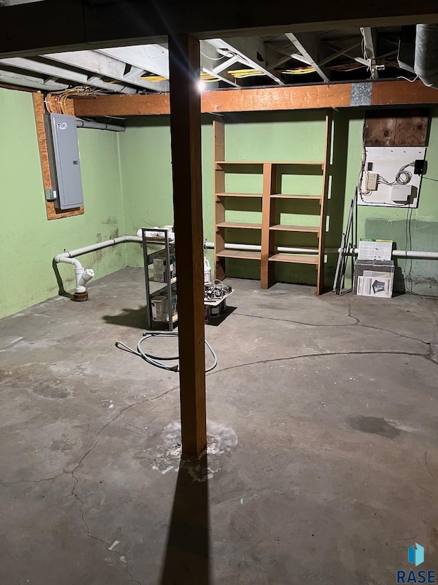 unfinished below grade area with electric panel