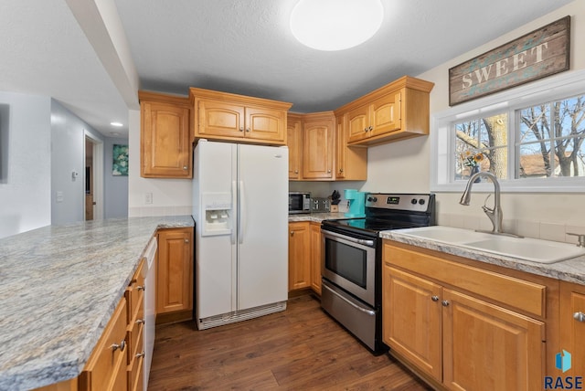 kitchen with dark wood-type flooring, stainless steel range with electric stovetop, a peninsula, white fridge with ice dispenser, and a sink