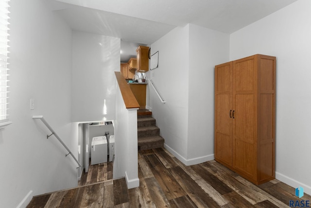 stairs featuring baseboards and wood finished floors