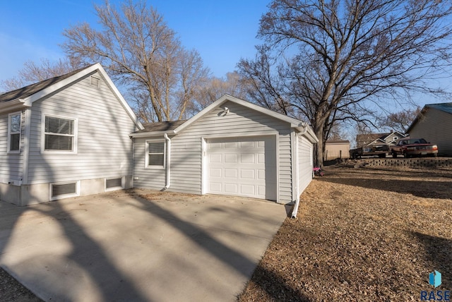 view of side of property with driveway