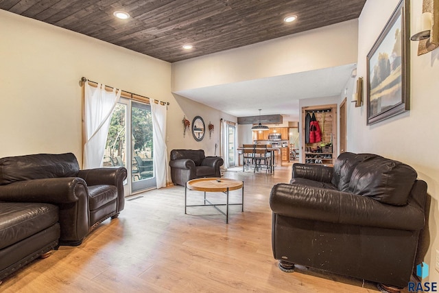 living room featuring visible vents, light wood-style flooring, recessed lighting, and wooden ceiling