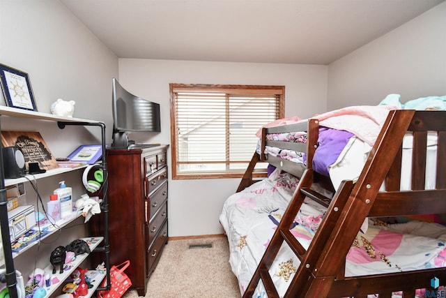 carpeted bedroom with baseboards