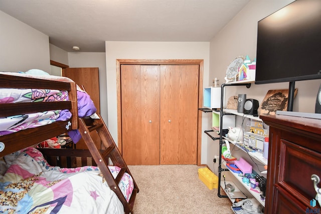 bedroom with carpet flooring and a closet