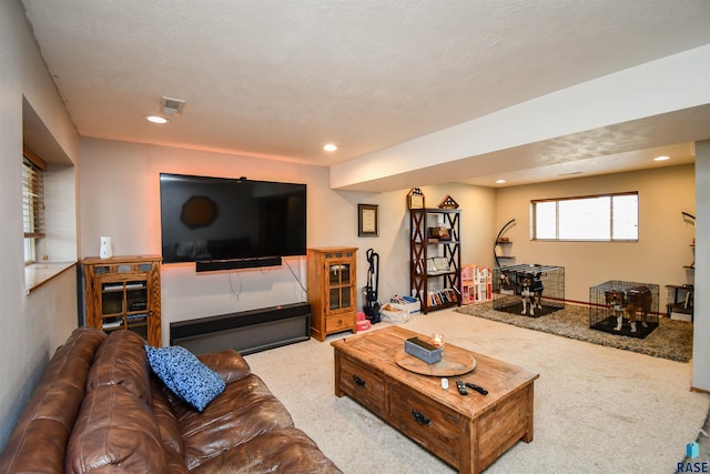 living area with carpet flooring, recessed lighting, and visible vents