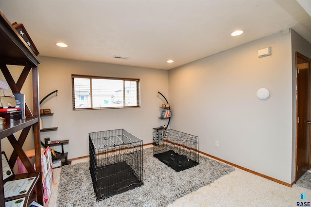 interior space with baseboards, visible vents, carpet, and recessed lighting