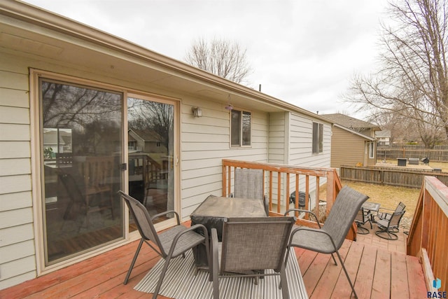 wooden deck featuring fence and outdoor dining area