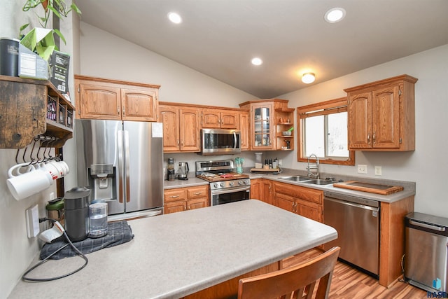 kitchen with stainless steel appliances, recessed lighting, a sink, open shelves, and vaulted ceiling