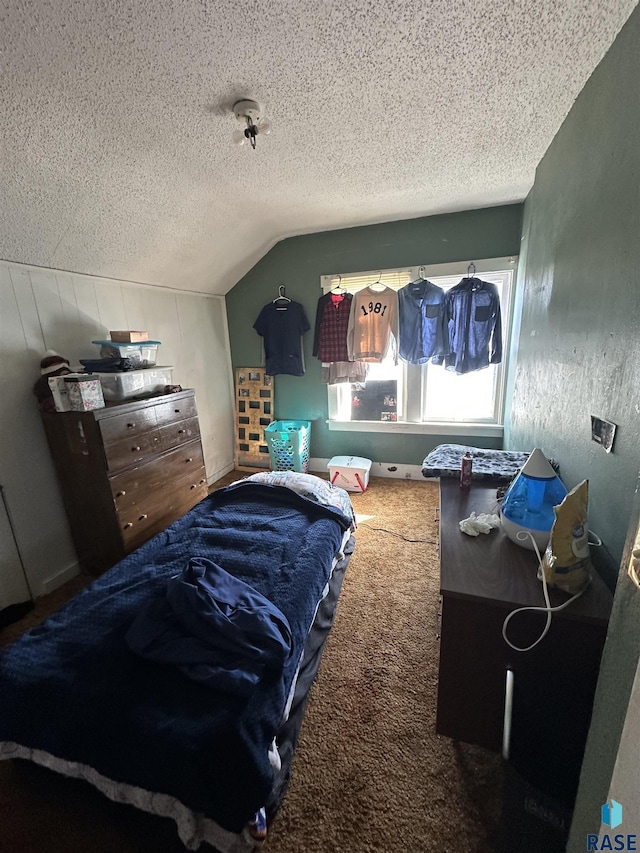 carpeted bedroom with lofted ceiling and a textured ceiling