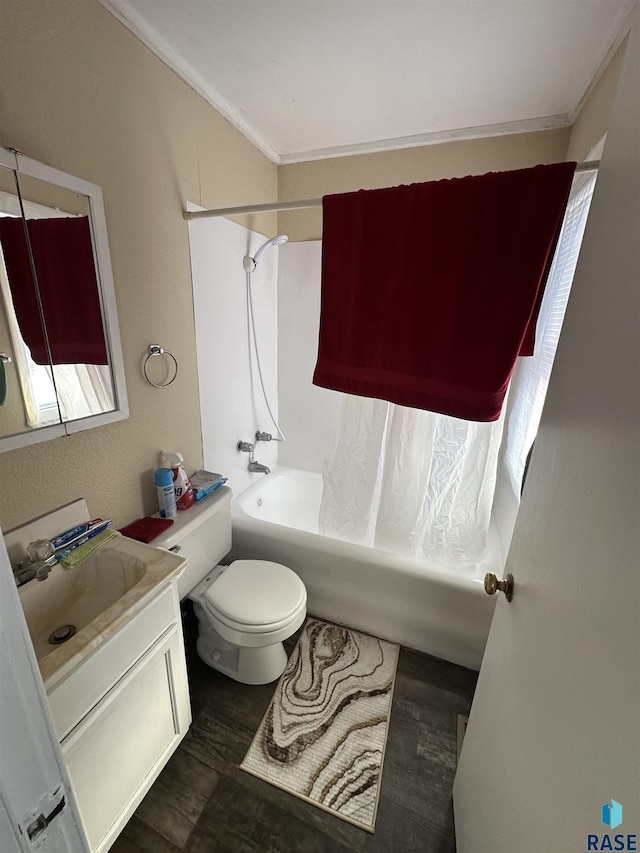 full bathroom featuring shower / bath combo, wood finished floors, toilet, and vanity