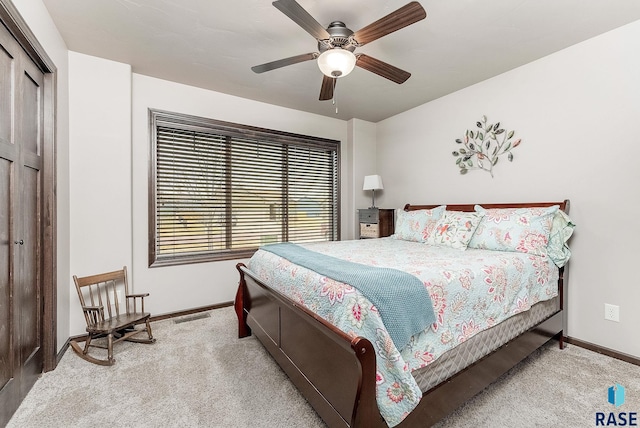 bedroom featuring baseboards, visible vents, ceiling fan, and carpet flooring