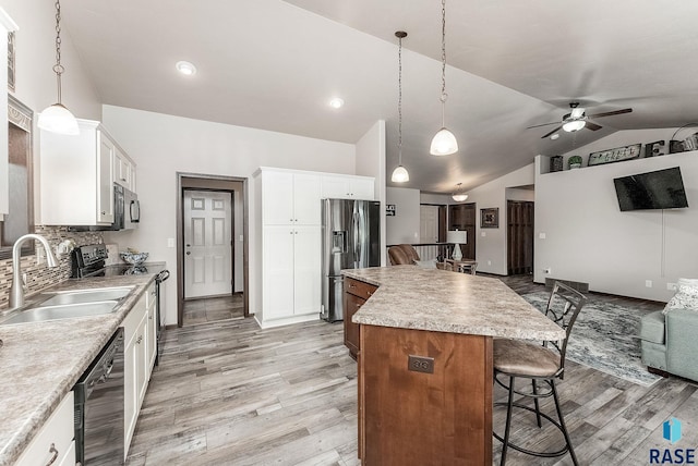 kitchen featuring open floor plan, stainless steel refrigerator with ice dispenser, electric stove, a sink, and ceiling fan