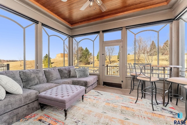 sunroom / solarium with wooden ceiling, crown molding, and wood finished floors