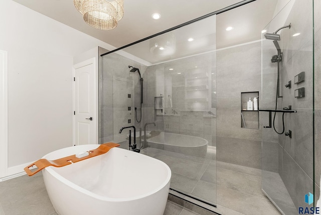full bath with a tile shower, recessed lighting, and a freestanding bath