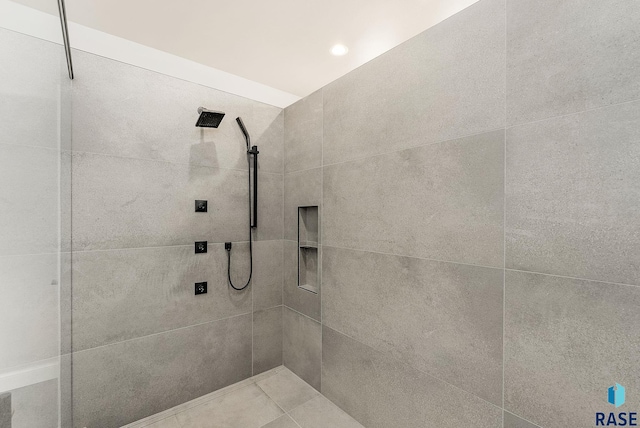 bathroom with a tile shower