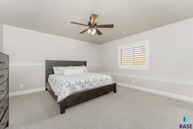 bedroom featuring baseboards, visible vents, carpet, and a ceiling fan