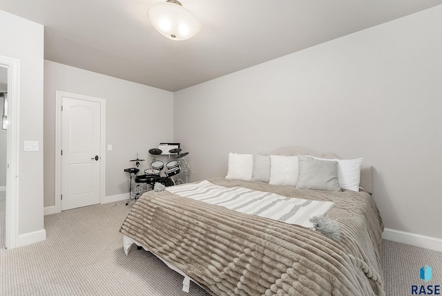 bedroom featuring carpet floors and baseboards