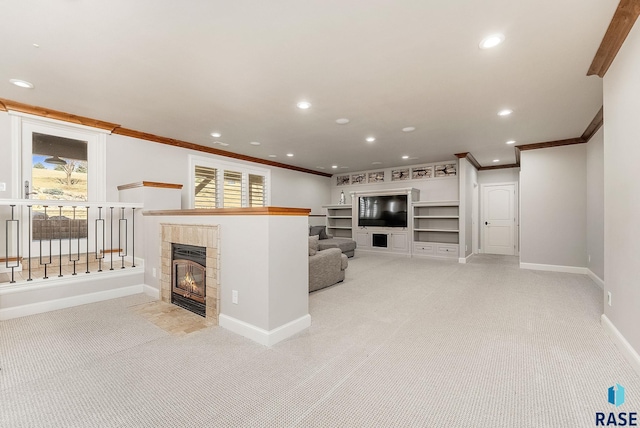 unfurnished living room with recessed lighting, ornamental molding, baseboards, light carpet, and a fireplace