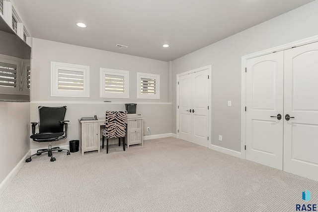 office space with carpet flooring, recessed lighting, baseboards, and visible vents