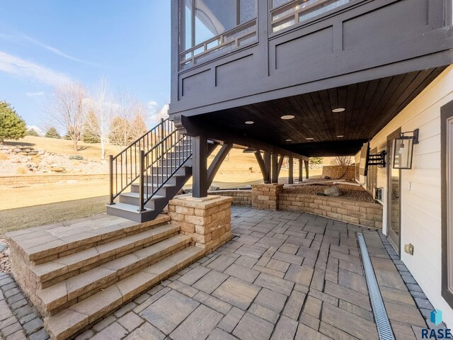 view of patio / terrace featuring stairs