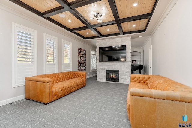 living room featuring carpet floors, a stone fireplace, coffered ceiling, and baseboards