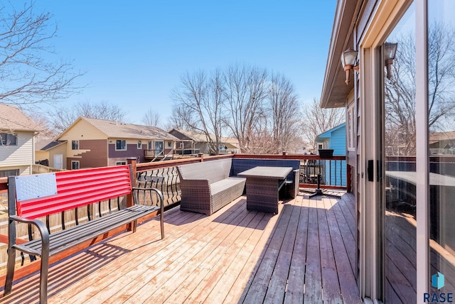 wooden terrace with a residential view