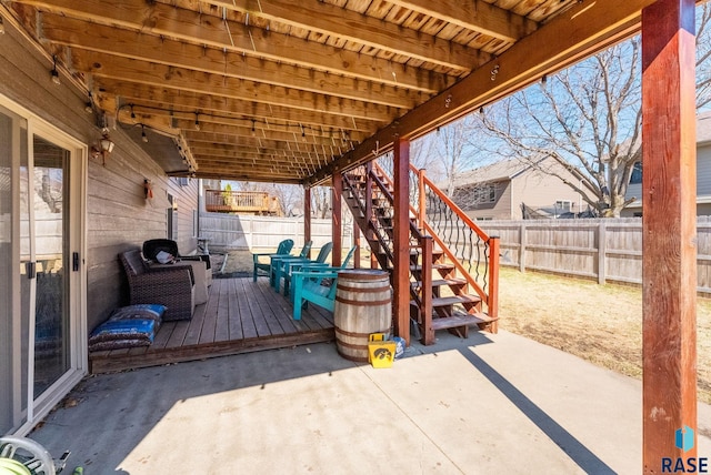 view of patio with stairs, a fenced backyard, and a wooden deck