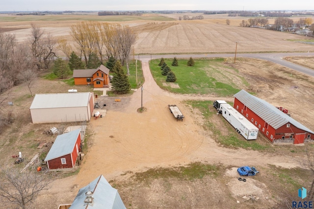 birds eye view of property featuring a rural view