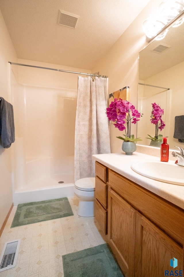 full bathroom with visible vents, toilet, and a shower stall