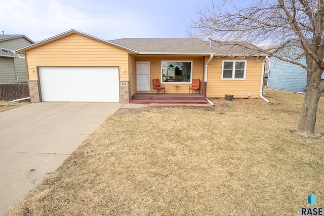 ranch-style home with a front yard, concrete driveway, a garage, and roof with shingles