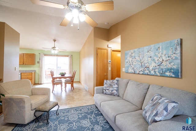living area with a ceiling fan, light tile patterned floors, and visible vents