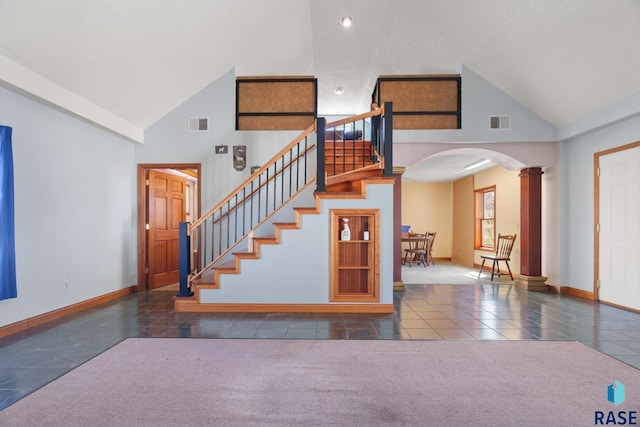 29783 Frog Creek Rd, Centerville, SD 57014 - staircase with carpet floors, arched walkways, high vaulted ceiling, and visible vents