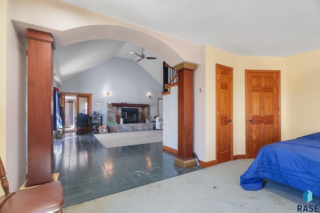 29783 Frog Creek Rd, Centerville, SD 57014 - carpeted bedroom with baseboards, lofted ceiling, arched walkways, and a glass covered fireplace