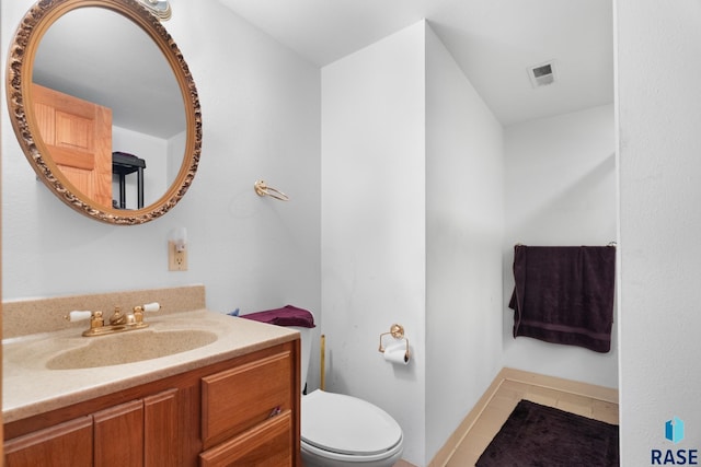 29783 Frog Creek Rd, Centerville, SD 57014 - half bath featuring visible vents, toilet, tile patterned floors, and vanity