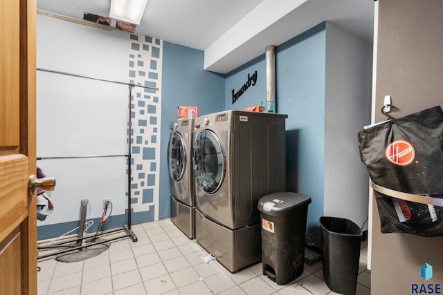 29783 Frog Creek Rd, Centerville, SD 57014 - clothes washing area with light tile patterned floors, laundry area, and washer and clothes dryer
