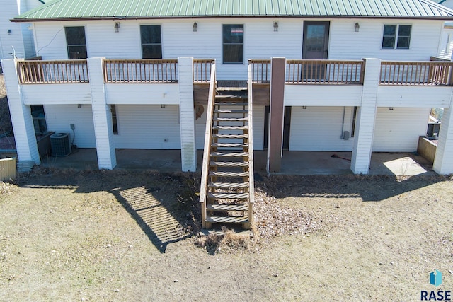 29783 Frog Creek Rd, Centerville, SD 57014 - rear view of house featuring stairs, metal roof, and cooling unit