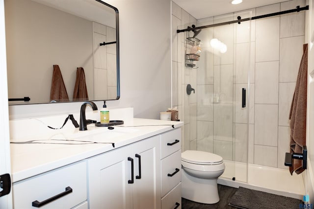 full bath featuring vanity, recessed lighting, toilet, and a shower stall