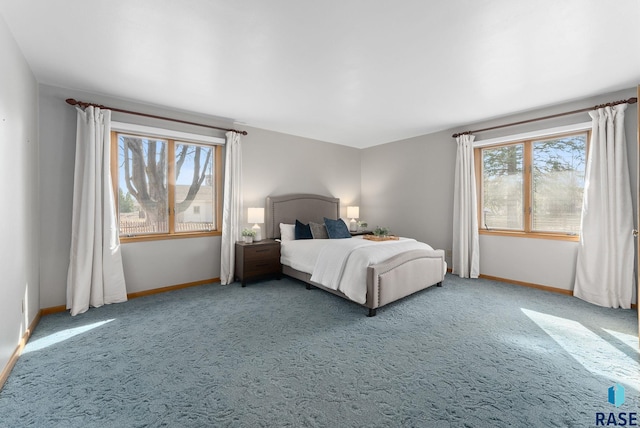 carpeted bedroom with baseboards