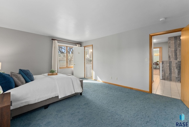 bedroom with baseboards, carpet floors, and tile patterned flooring