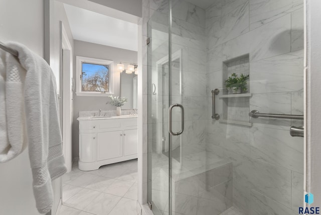 full bathroom with vanity and a stall shower
