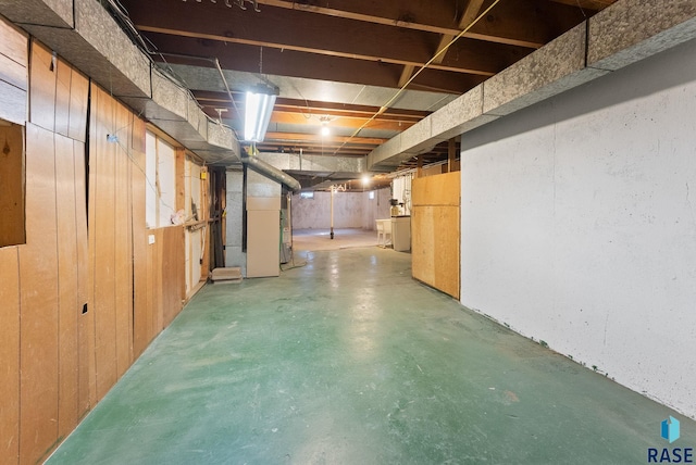 unfinished basement with washer / clothes dryer