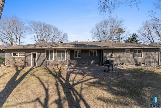 back of property with a yard