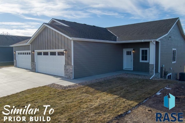 ranch-style house with stone siding, an attached garage, and board and batten siding