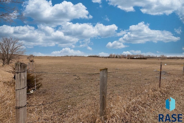 view of yard with a rural view