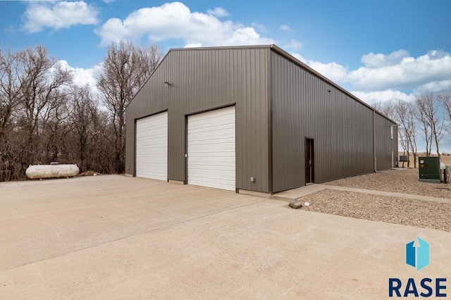 detached garage featuring cooling unit