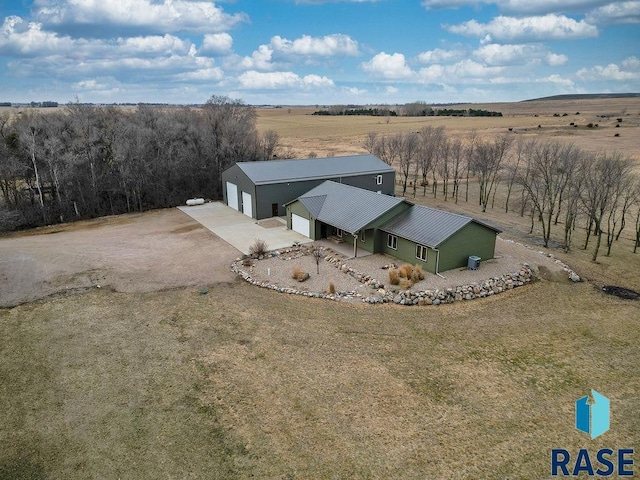 birds eye view of property with a rural view