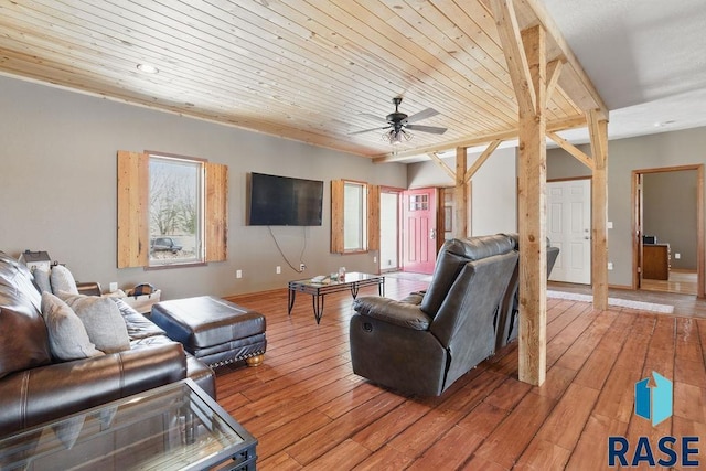 living room with wood ceiling, a wealth of natural light, light wood-style floors, and ceiling fan