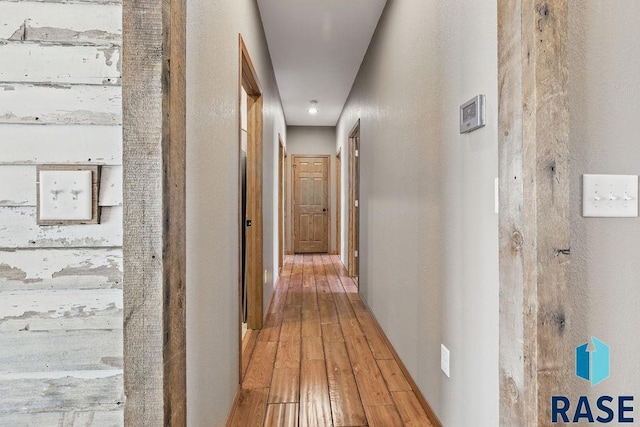 hall with wood-type flooring