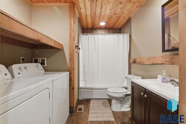 full bath with toilet, wooden ceiling, vanity, visible vents, and washer and dryer